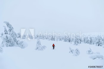 Mountaineer trekking in the snow at Lapland, Finland