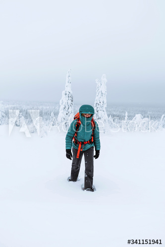 Mountaineer trekking in the snow at Lapland, Finland