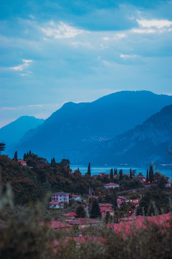 Mountains By the Lake Under Cloudy Sky