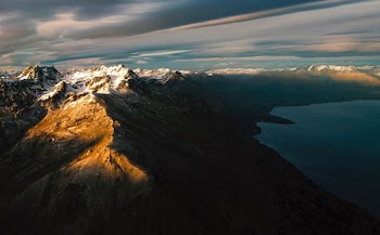 mountains near body of water