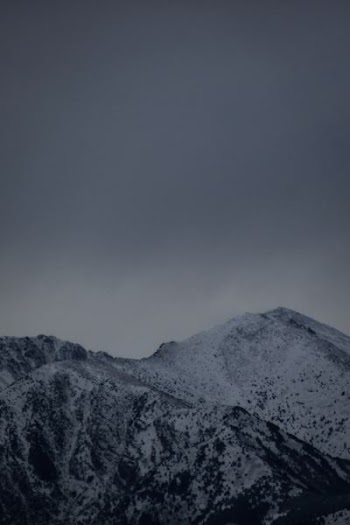 mountains under cloudy sky