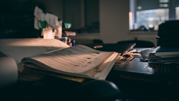 Mouse and Books on Black Surface