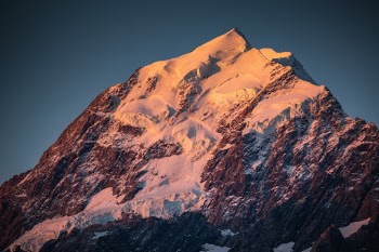 Mt Cook illuminated in alpenglow. The end of a great hike, after traveling halfway around the world to get here. The skies would darken soon after this and I hiked back in some of the darkest skies I've seen. The amount of stars in the sky was amazing.