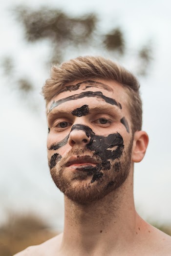 Mud on Man's Face