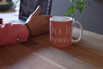 Mug Beside Person's Hand