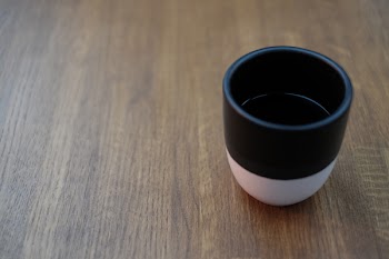 Mug of coffee on a wooden table