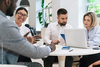 Multi-ethnic business people during meeting in modern office