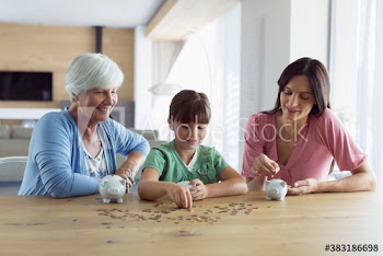 Multi-generation women counting coins from piggybanks