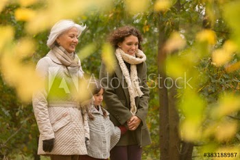Multi-generation women walking in autumn park