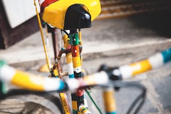 multicolored bicycle on concrete road