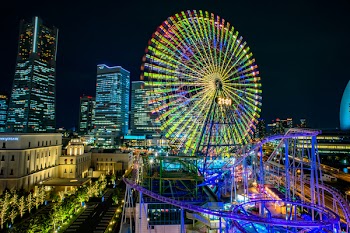 Multicolored Led Lights on Ferris Wheel and Roller Coaster during Nighttime