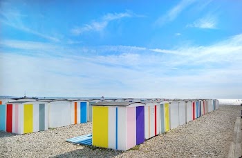 multicolored sheds near shore during day
