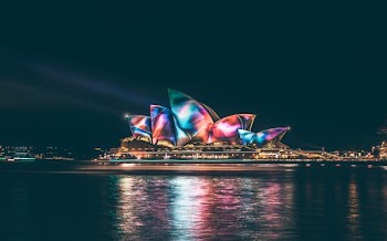 multicolored Sydney Opera House at nighttime