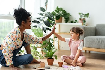 Multiracial family high five while indoor… | Free stock photo | High Resolution image