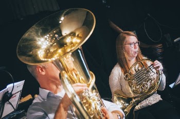 Musician playing brass instrument, October | Free Photo - rawpixel