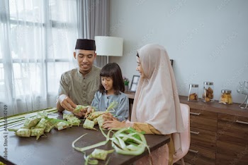 muslim asian family making ketupat for eid mubarak together