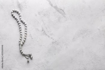 Muslim beads on light background