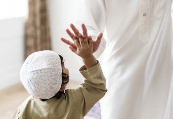 Muslim boy giving a high | Free Photo - rawpixel