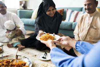 Muslim family having dinner on the floor