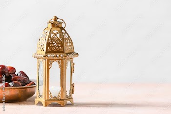 Muslim lamp and dates on light background