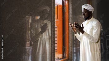muslim man having worship and praying for allah blessing in islam ceremony in mosque during islamic ramadan period