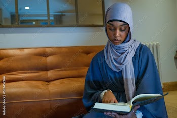 Muslim woman praying at home