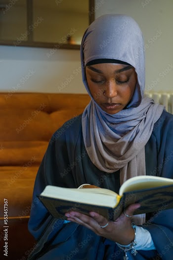 Muslim woman praying at home