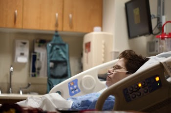 My wife about one hour after her right hemicolectomy surgery.