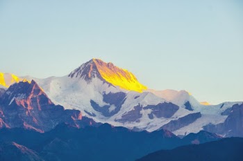My wife and I recently visited Nepal. One morning during our trip I was able to capture this heavenly sunrise on Annapurna circuit of the great Himalaya. 

The morning was freezing cold but the view was breathtaking. Totally worth it.