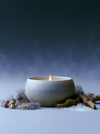 Mysterious Dark Candle in Ceramic Jar
