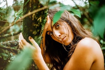 Naked Woman Holding Tree Branch