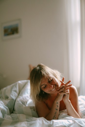 Naked Woman Laying On Bed