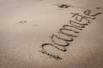 Namaste Text on Sand
