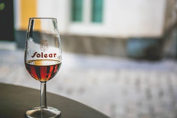 Near Empty Drinking Glass on Wooden Surface