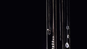 Necklaces Hanging On Black
