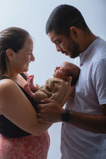 New Parents Adoring Their Newborn Baby