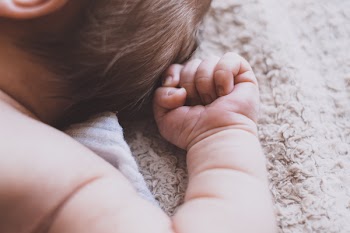 Newborn baby’s arm