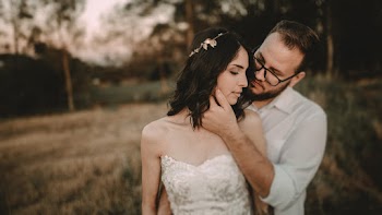 Newly Wed Couple at a Brown Field
