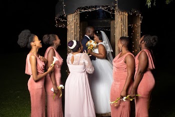 Newly Wed Couple With Five Bridesmaids