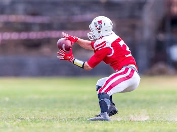 Nfl Player Catching Football