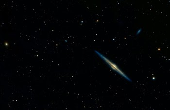 NGC 4565 – the Needle Galaxy

Located between 30 – 50 million light years away, it’s the most prominent edge-on spiral galaxies we have in our view. Residing near the North Galactic Pole in the constellation Coma Berenices (named for “Berenice's Hair" in Latin and refers to Queen Berenice II of Egypt, who cut off her hair in gratitude to the gods for the safe return of her husband from battle), it has a spatial diameter of 140,000 light-years (Milky Way = 105,000 ly) and is estimated to contain a trillion stars (Milky Way 250-400 billion). With the darkness from a central dust lane obscuring much of the visual core of the galaxy, it’s very similar to our view of the core our Milky Way, and as such is studied extensively by astronomers.