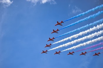 Nine Brown Jet in Sky