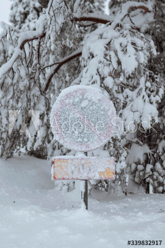 No parking sign covered in snow
