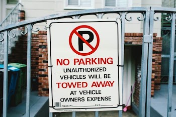 no parking signage on gate