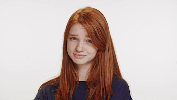 Not-impressed cute foxy Caucasian teenage girl wearing dark blue t ...