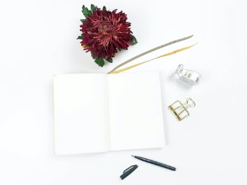 Notebook Flatlay with Chrysanthemum

Bright topview flatlay photography with blank notebook and crimson red chrysanthemum flower, golden white masking tape, black brush pen, and golden paper clip. Ideal for hand lettering purpose.