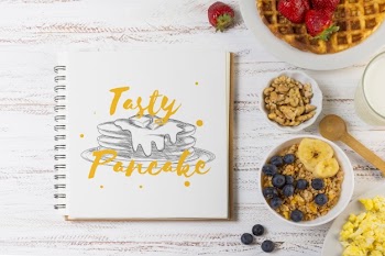 Notebook mockup with breakfast concept Free Psd