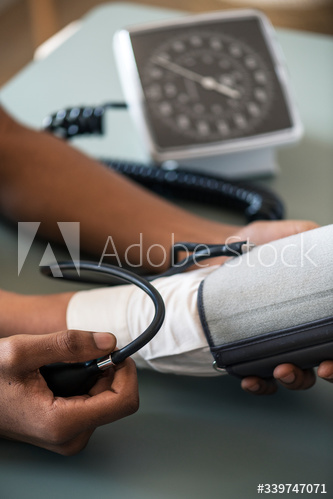 Nurse measuring patient blood pressure