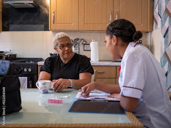 Nursevisiting mature woman at her house