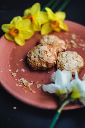 oatmeal cookies and daffodil flowers on plate